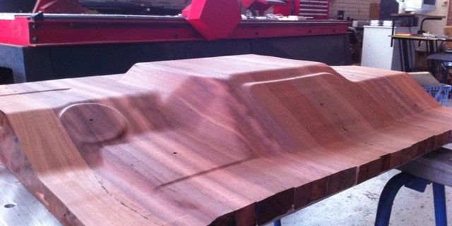 The CNC Routed wooden buck for hand forming the footwell